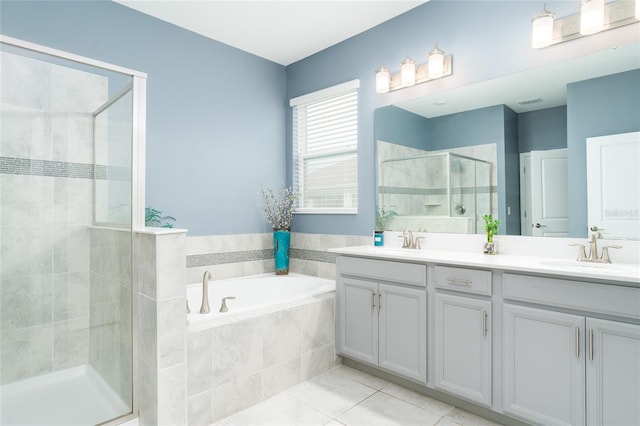 bathroom with vanity, tile patterned floors, and independent shower and bath