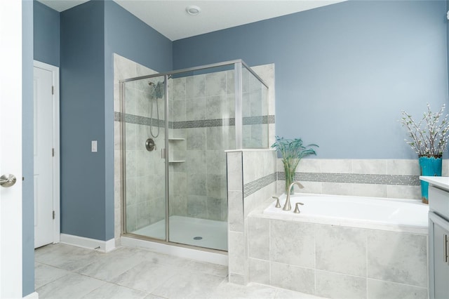 bathroom with vanity, separate shower and tub, and tile patterned flooring