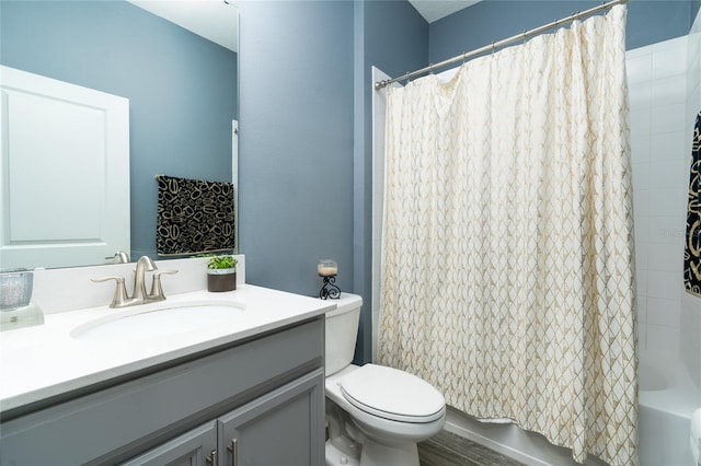 full bathroom featuring vanity, toilet, and shower / bathtub combination with curtain