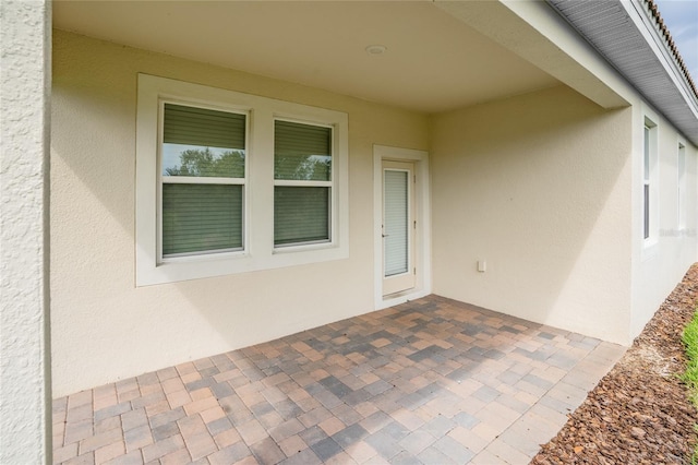 property entrance with a patio