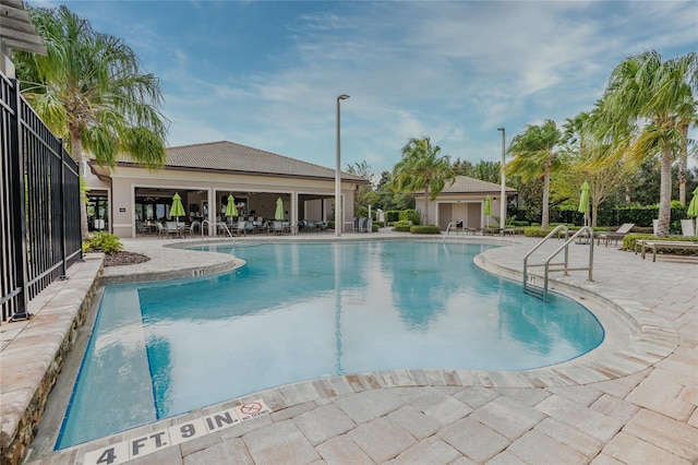 view of swimming pool with a patio area