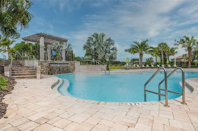 view of swimming pool with a patio