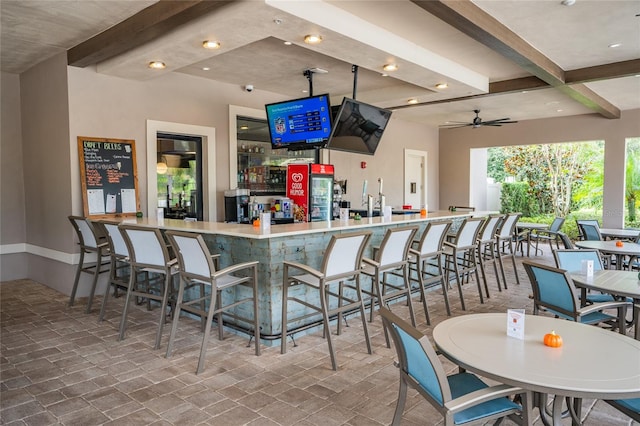 bar featuring ceiling fan and beam ceiling