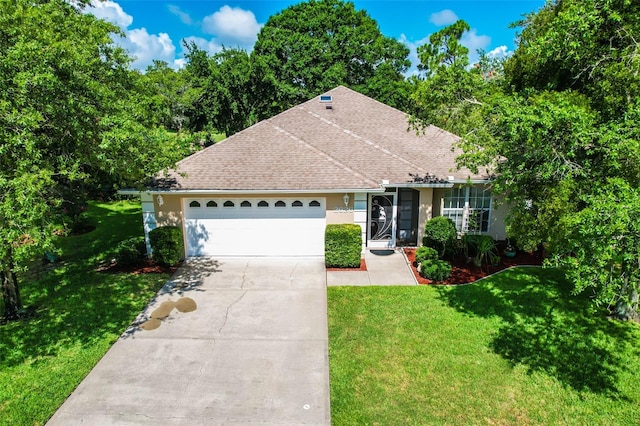 ranch-style house featuring a garage and a front lawn