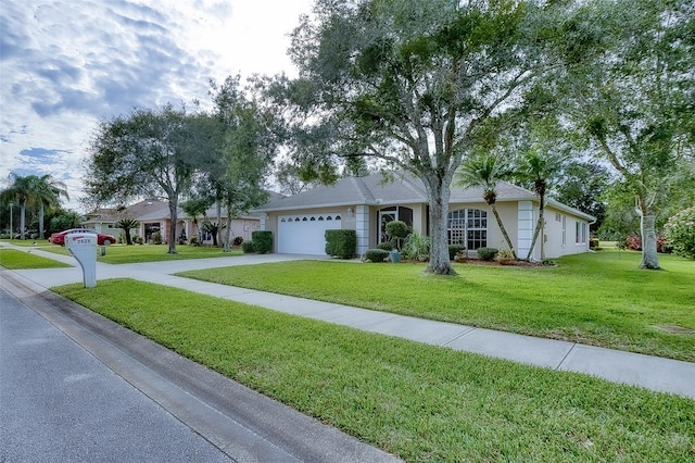 ranch-style home with a front yard and a garage