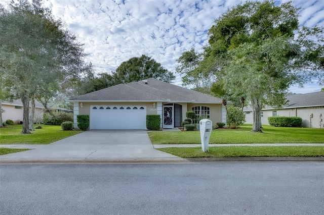 single story home with a front yard and a garage