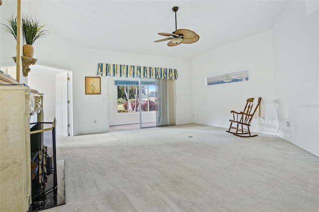 carpeted living room featuring ceiling fan