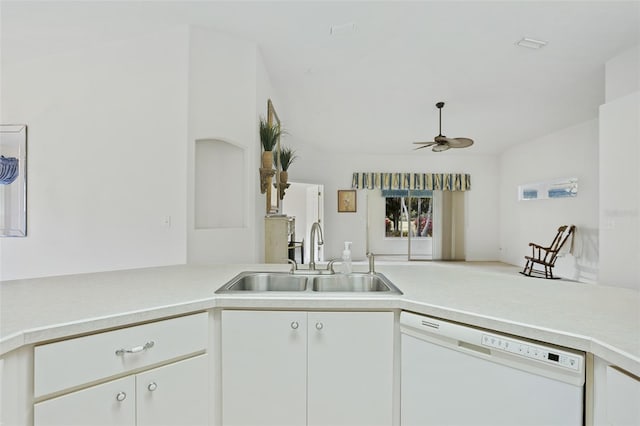 kitchen with sink, dishwasher, kitchen peninsula, white cabinetry, and ceiling fan