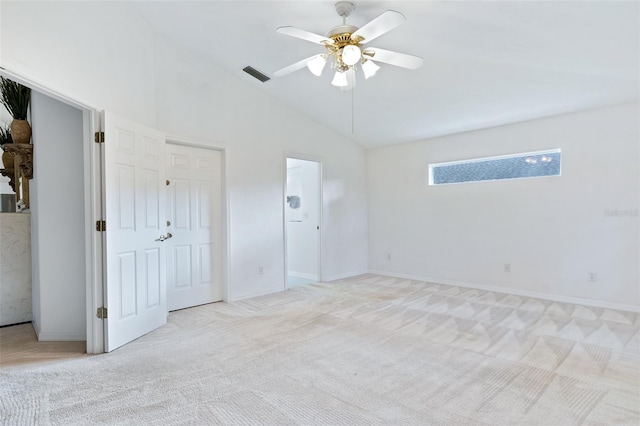 unfurnished room featuring light colored carpet, high vaulted ceiling, and ceiling fan