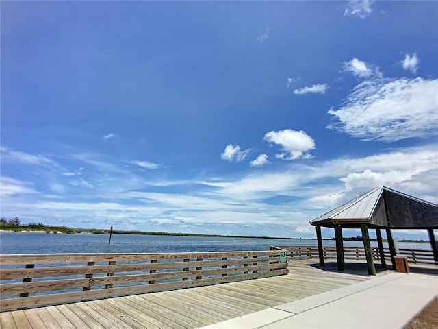 dock area with a gazebo and a water view