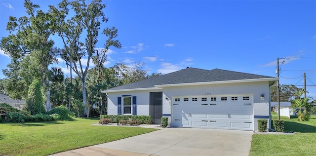 ranch-style home featuring a garage and a front lawn