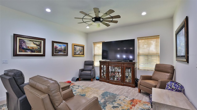 living room with hardwood / wood-style floors and ceiling fan