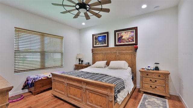 bedroom featuring light hardwood / wood-style floors and ceiling fan