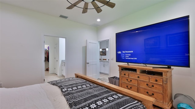 bedroom with ensuite bathroom and ceiling fan