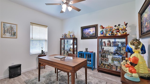 home office with ceiling fan and light wood-type flooring