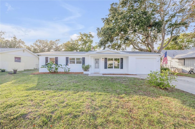 single story home with a garage and a front yard