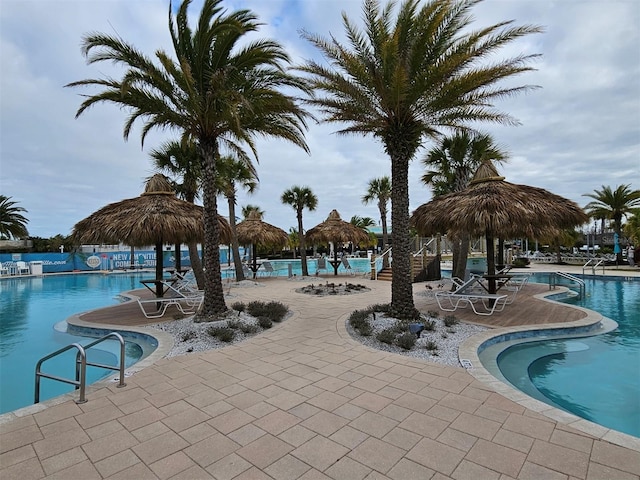 view of swimming pool featuring a patio and a gazebo