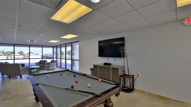 rec room with pool table, a wall of windows, a drop ceiling, and baseboards