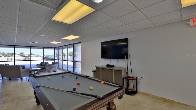 501 N Causeway Unit 2050, New Smyrna Beach, FL 32169 - game room with billiards, a drop ceiling, expansive windows, and baseboards
