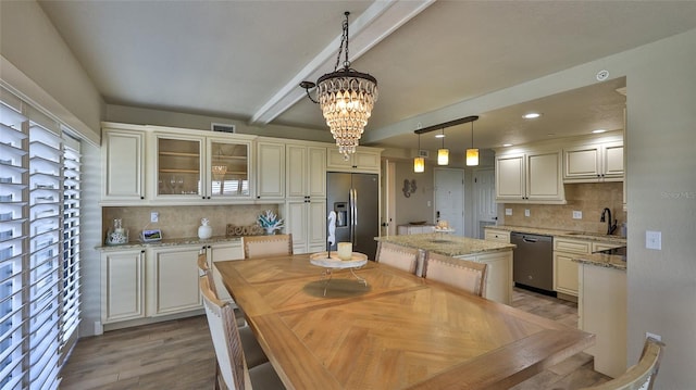 dining room featuring visible vents, an inviting chandelier, light wood-type flooring, beam ceiling, and recessed lighting