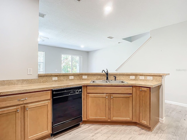 679 Mount Olympus Blvd, New Smyrna Beach, FL 32168 - kitchen with black dishwasher, a sink, light countertops, light wood-type flooring, and a peninsula