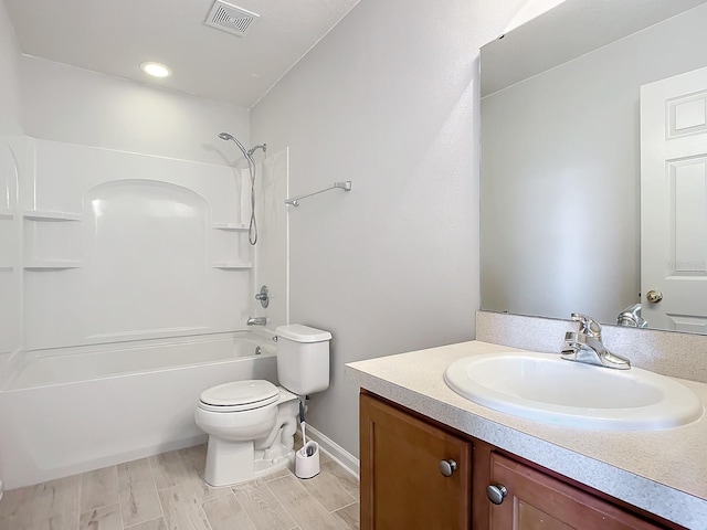 full bathroom featuring vanity, toilet, wood-type flooring, and tub / shower combination