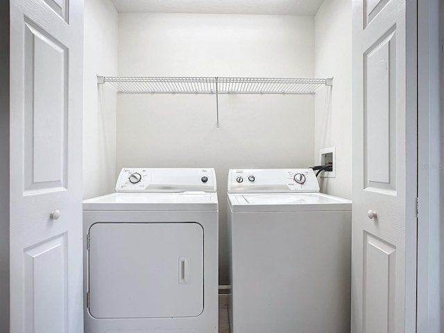 laundry area with separate washer and dryer