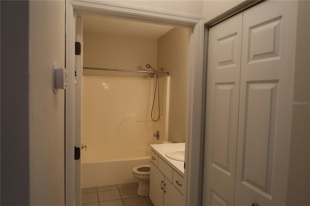 full bathroom with vanity, toilet, tile patterned floors, and washtub / shower combination