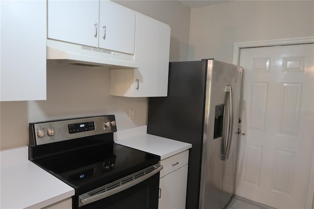 kitchen with appliances with stainless steel finishes and white cabinetry