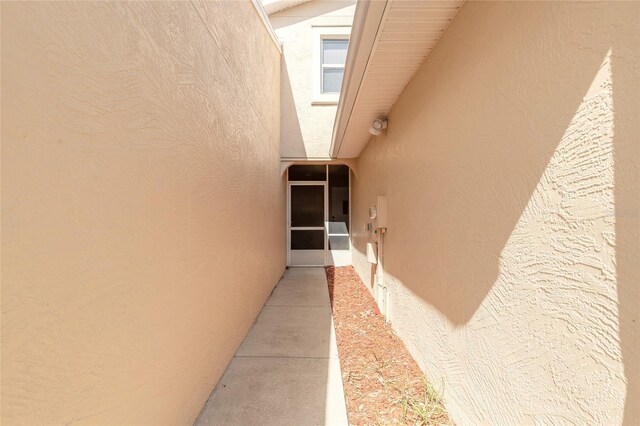 2266 Hawks Cove Cir, New Smyrna Beach, FL 32168 - doorway to property with stucco siding