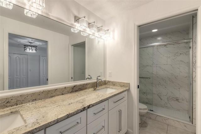 bathroom featuring vanity, tile patterned floors, toilet, and walk in shower