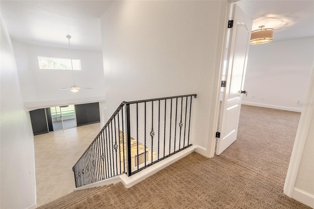 2266 Hawks Cove Cir, New Smyrna Beach, FL 32168 - corridor with an upstairs landing, carpet flooring, baseboards, and a towering ceiling