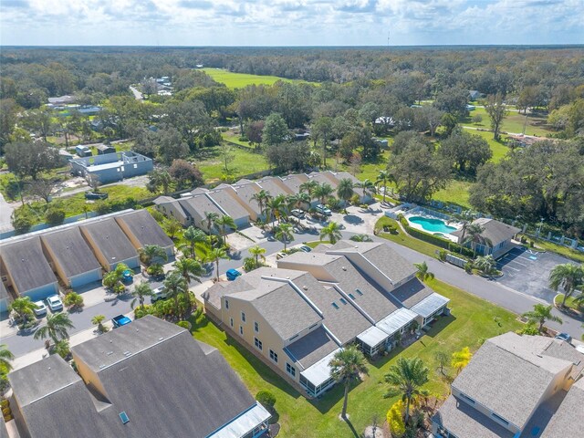 2266 Hawks Cove Cir, New Smyrna Beach, FL 32168 - aerial perspective of suburban area featuring a pool and a heavily wooded area