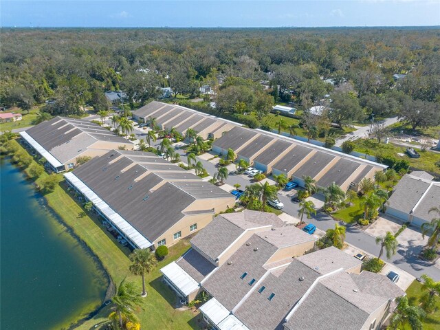 2266 Hawks Cove Cir, New Smyrna Beach, FL 32168 - aerial overview of property's location with a nearby body of water, a heavily wooded area, and nearby suburban area