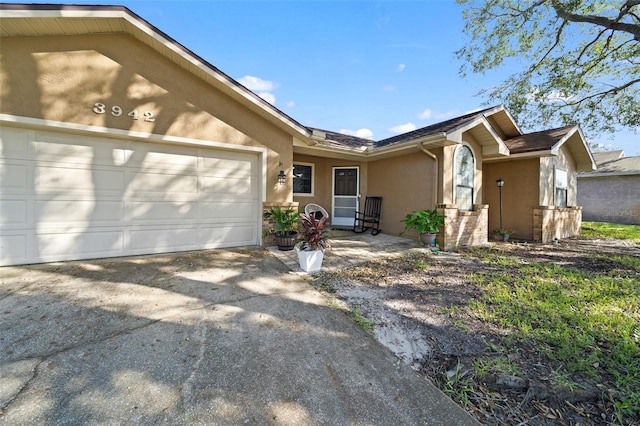 ranch-style home with a garage