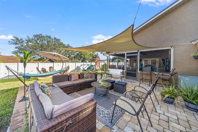 view of patio / terrace featuring a sunroom and an outdoor hangout area