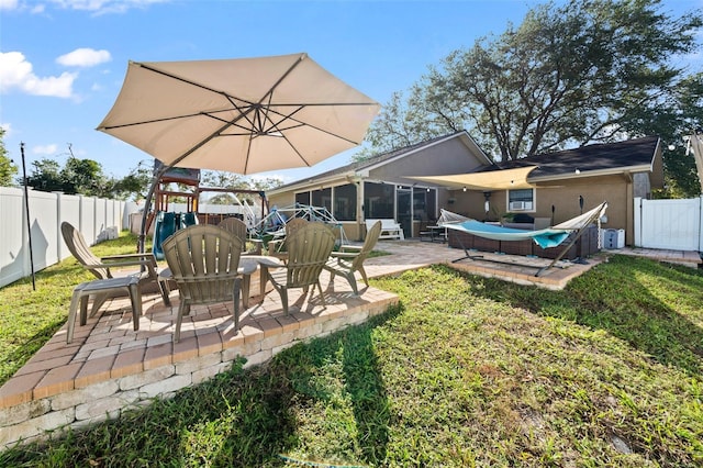 view of yard with a patio and a sunroom