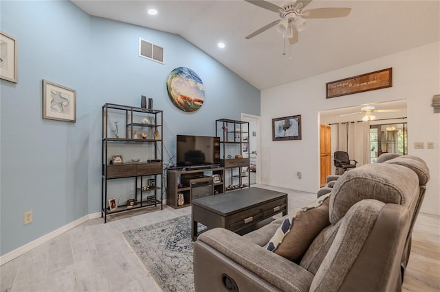 living room featuring high vaulted ceiling, light wood-type flooring, and ceiling fan