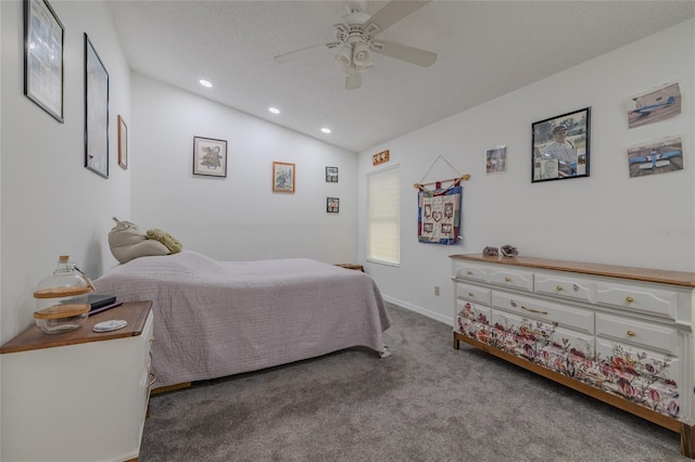 carpeted bedroom featuring ceiling fan and vaulted ceiling