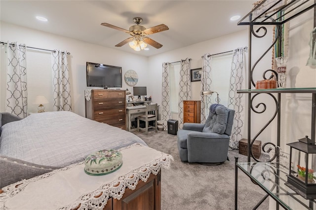 carpeted bedroom featuring ceiling fan