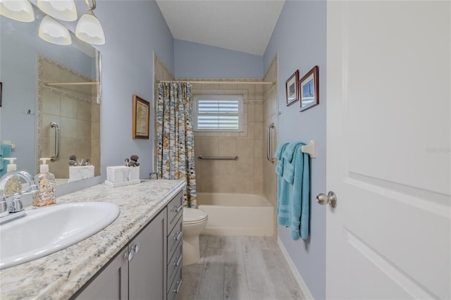 full bathroom with lofted ceiling, shower / bath combo with shower curtain, toilet, hardwood / wood-style floors, and vanity