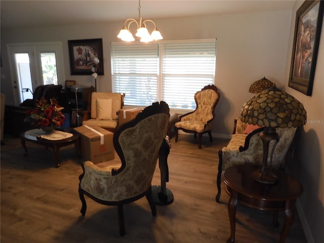 interior space featuring a chandelier and hardwood / wood-style flooring