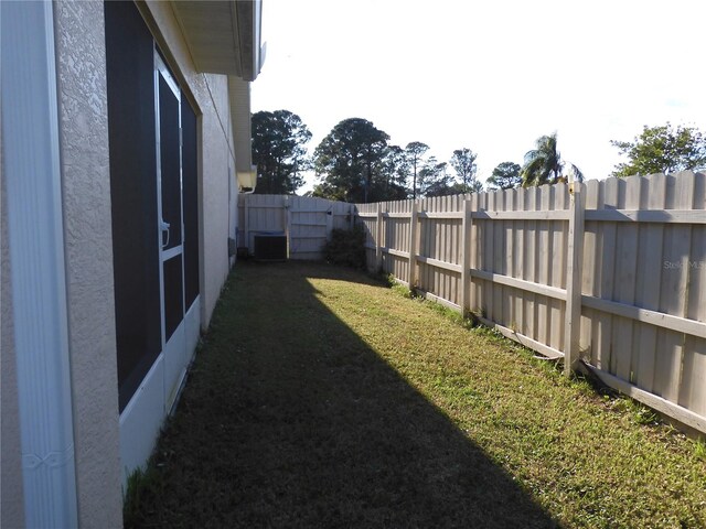 view of yard featuring central air condition unit