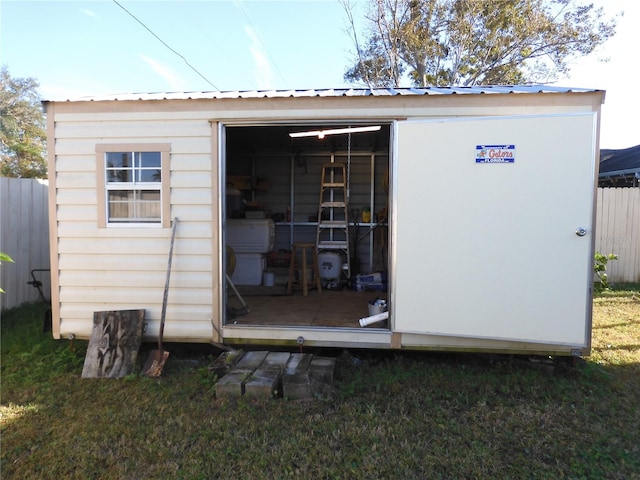 view of outdoor structure featuring a yard