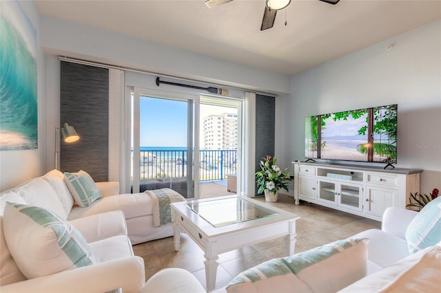 living area featuring light tile patterned floors and a ceiling fan