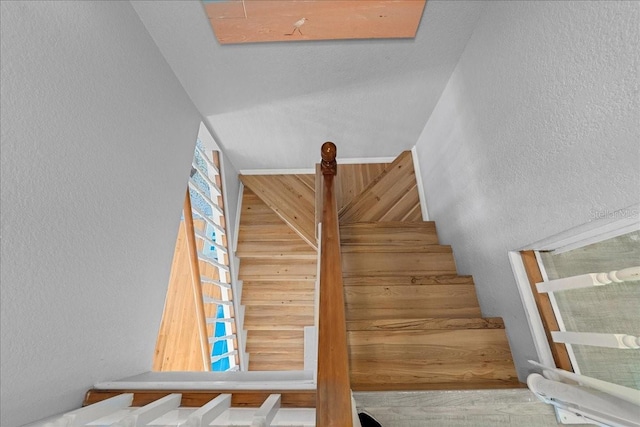 stairs with hardwood / wood-style floors