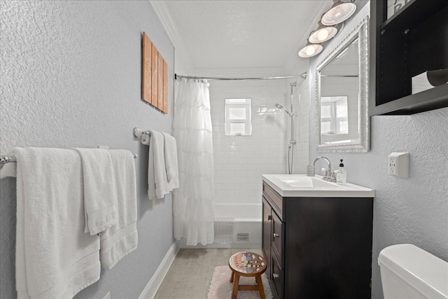 full bathroom featuring shower / bath combo with shower curtain, a textured ceiling, toilet, and vanity