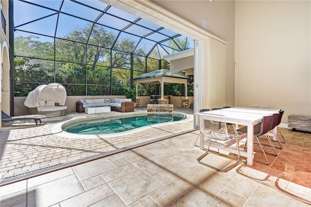 view of swimming pool featuring a lanai, an outdoor living space, and a patio area