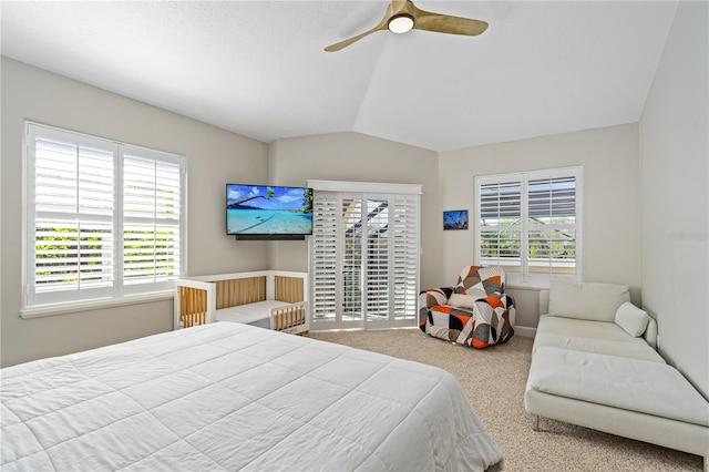 bedroom with carpet flooring, multiple windows, lofted ceiling, and ceiling fan