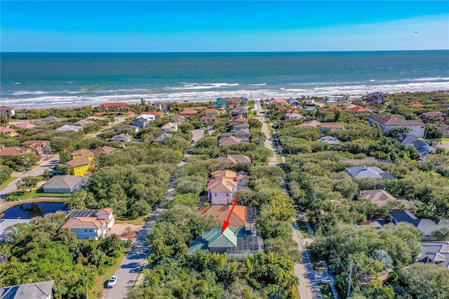 bird's eye view featuring a view of the beach and a water view